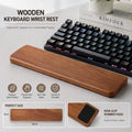 Solid wood keyboard wrist rest in front of a mechanical keyboard