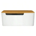 Cable concealer box with a bamboo lid covering an extension cord