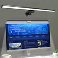 Dimmable monitor light bar mounted on top of a computer display