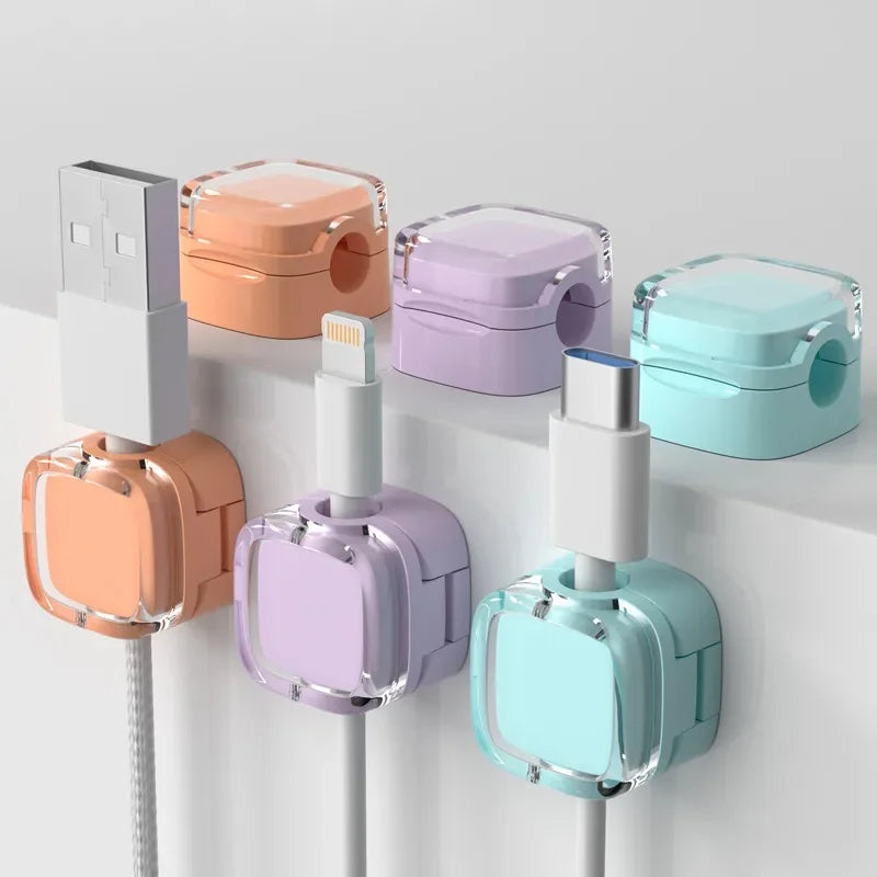 Set of magnetic cable hooks mounted under a desk edge