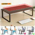 Monitor riser with under-shelf storage compartments on a tidy desk