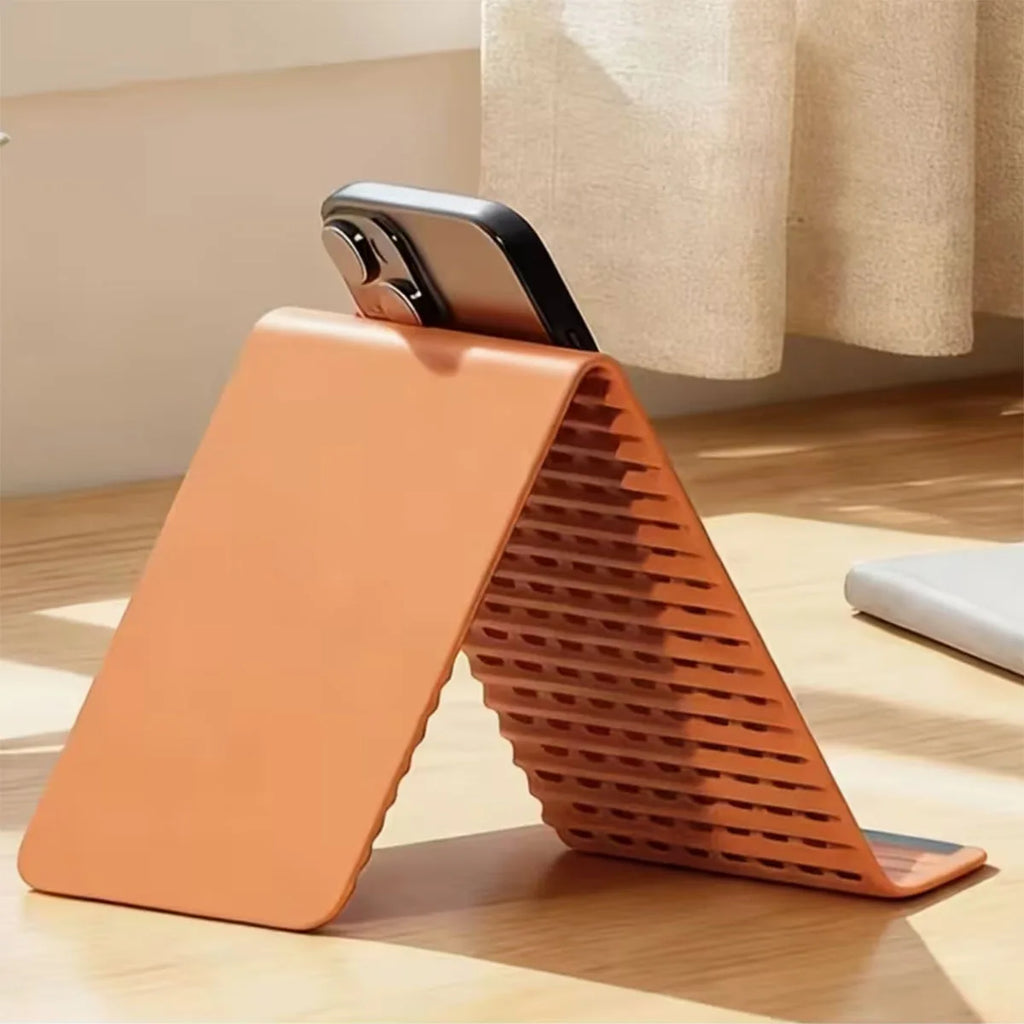Multi-layer folding aluminum stand holding a phone and tablet