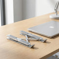 Adjustable aluminum laptop stand set to a raised working height