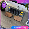 Split walnut palm rest shaped for an Alice layout keyboard