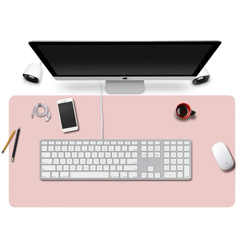 Large stitched vegan leather desk pad under a keyboard and mouse
