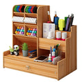 Wooden desk organizer with an open drawer and pen compartments