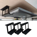 Under-desk laptop mount holding a closed notebook beneath a desk