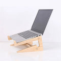 Detachable wooden laptop riser lifting a notebook for airflow