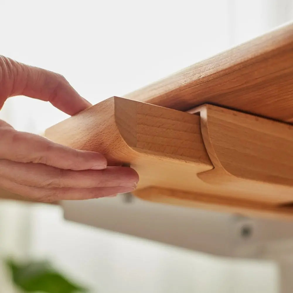 Pull-out under-desk storage tray in bamboo holding desk items