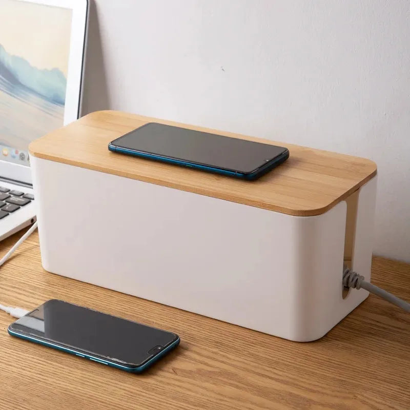 Wooden cable storage box with a lifting lid hiding chargers